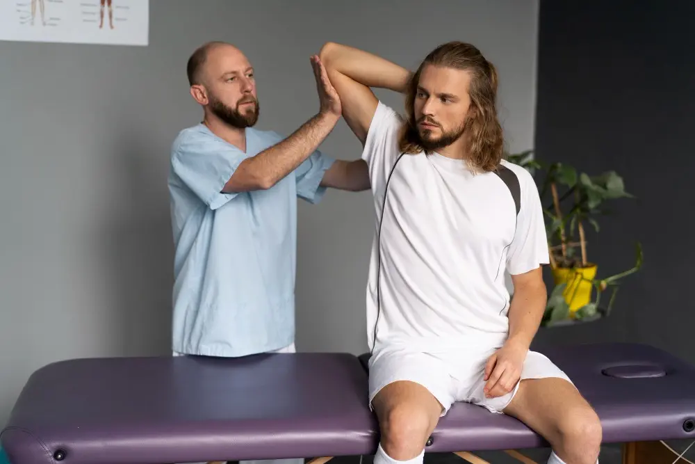Chiropractors helping patient with arm stretching