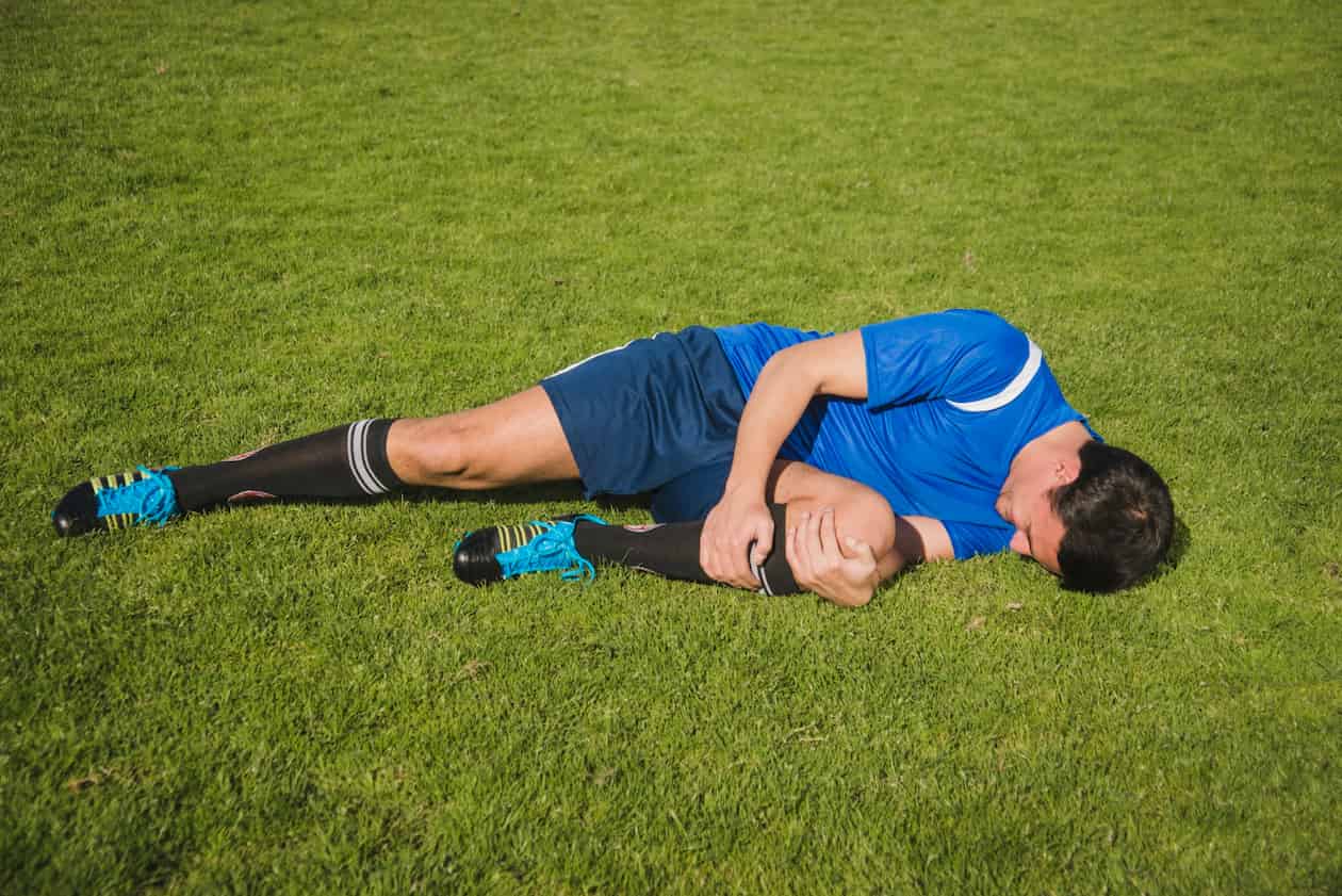 Soccer Athlete With Injury On Ground