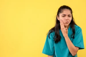 Patient experiencing jaw pain related to TMJ dysfunction