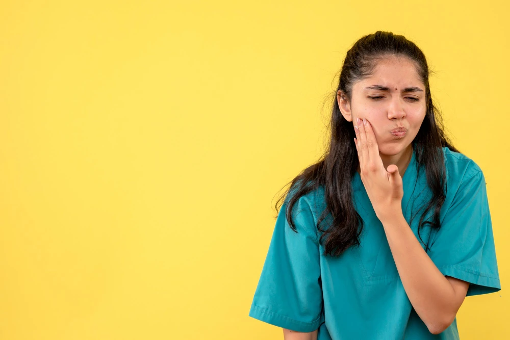 Patient experiencing jaw pain related to TMJ dysfunction
