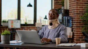 Worker experiencing injury pain receiving chiropractic care