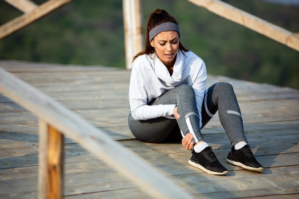 Person exercising while noticing muscle soreness and joint pain